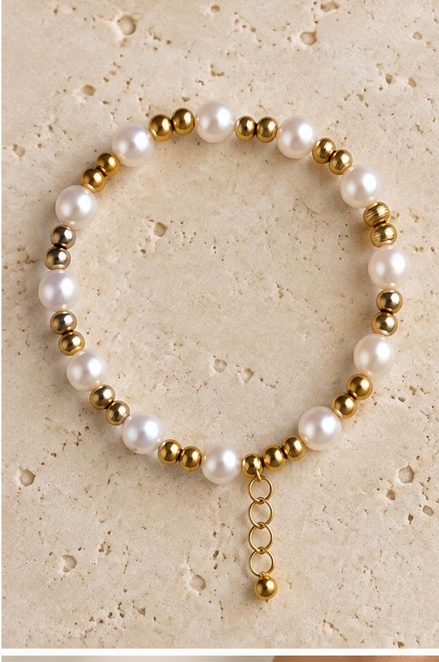 Pearl-like & Gold-tone Spacer Bracelet on travertine
