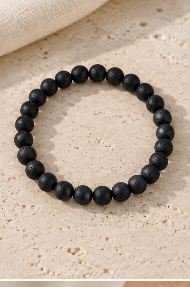 Matte Black Bead Bracelet on travertine