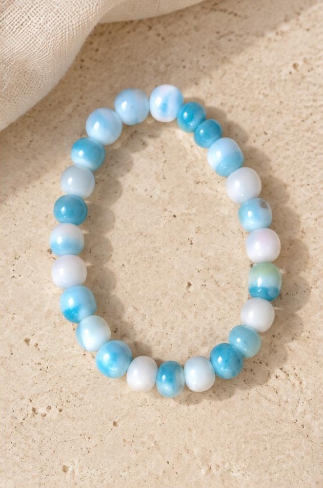 Sky & White Bead Bracelet on travertine