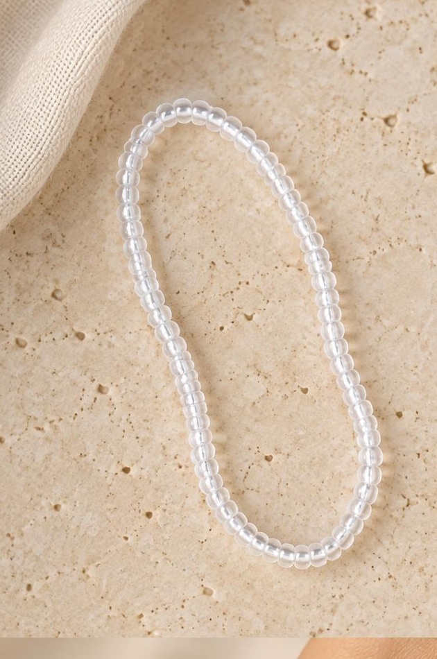 White Seed Bead Bracelet on travertine