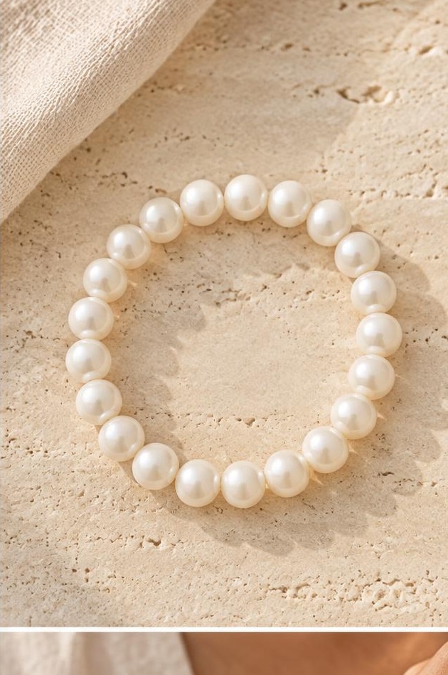 White Round Bead Bracelet on travertine