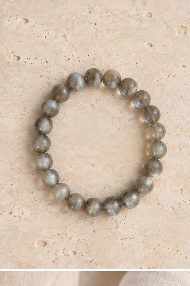 Silver-grey Bead Bracelet on travertine