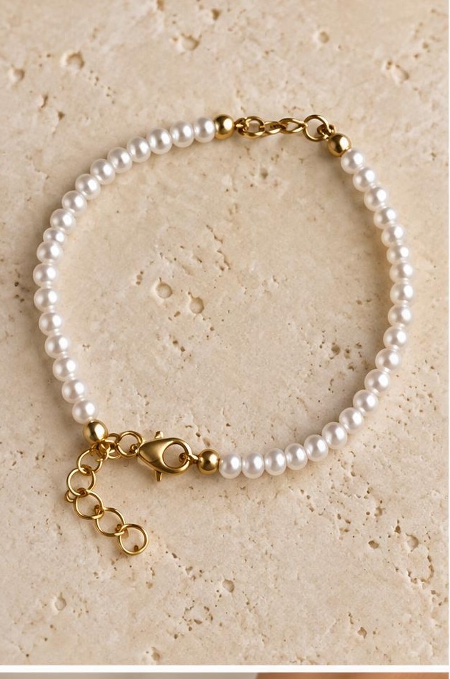 Pearl-like Fine Clasp Bracelet on travertine