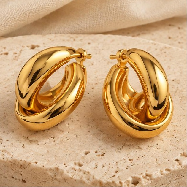 Intertwined Gold-tone Hoops on travertine