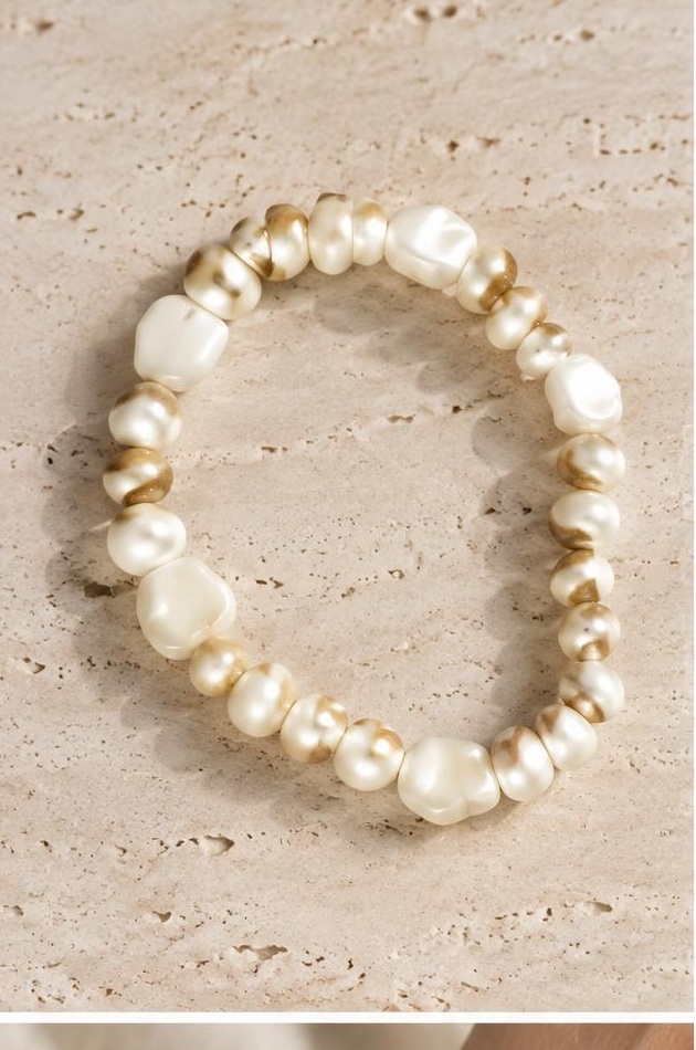 Ivory Irregular Bead Bracelet on travertine