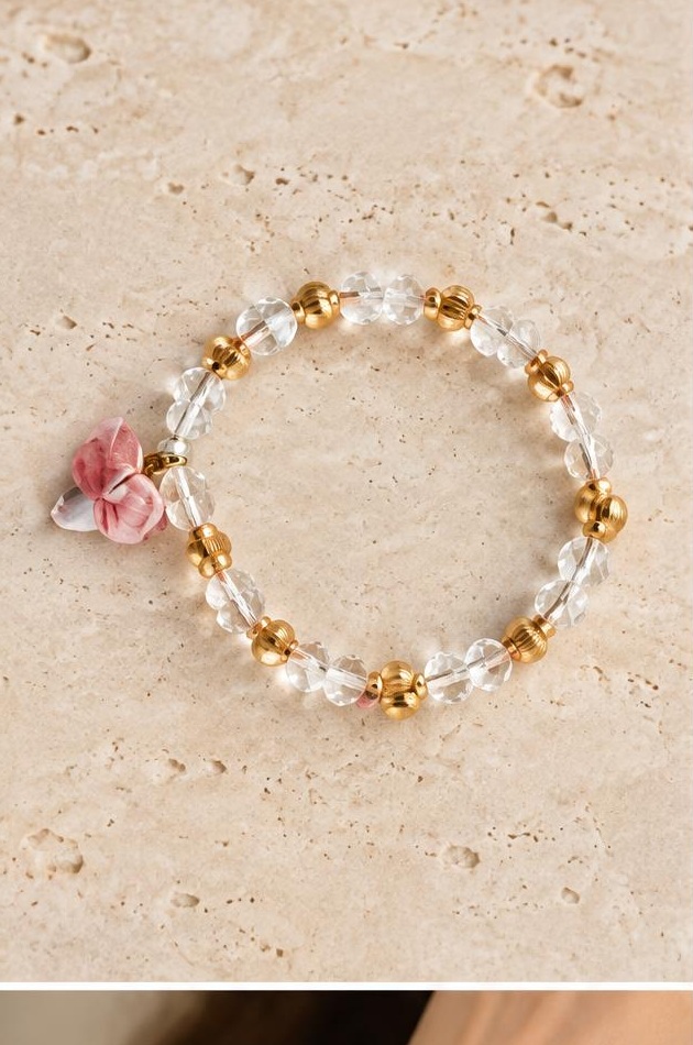 Rose & Clear Charm Bracelet on travertine
