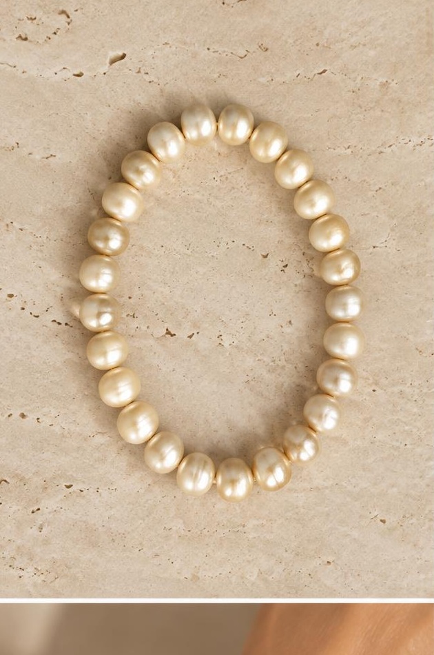 Champagne Bead Bracelet on travertine