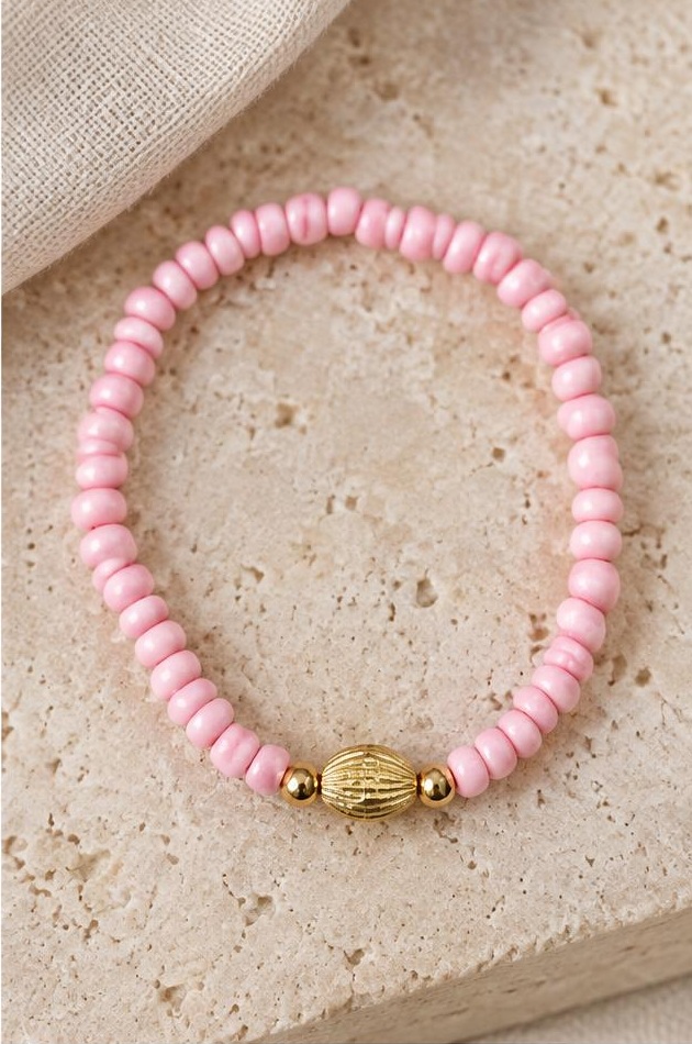 Pink & Gold Accent Bracelet on travertine