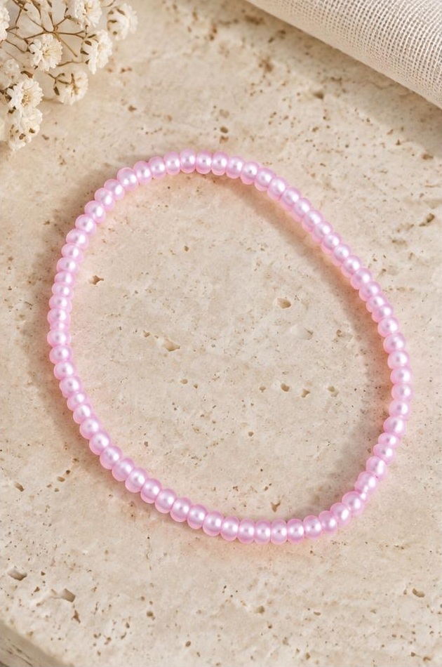 Pink Seed Bead Bracelet on travertine