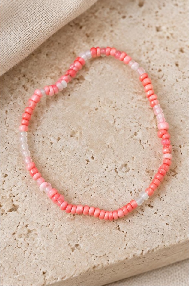Coral Mix Bead Bracelet on travertine