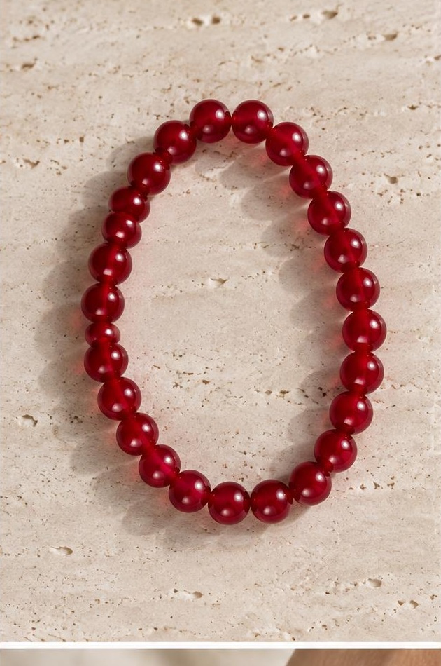 Cranberry Bead Bracelet on travertine