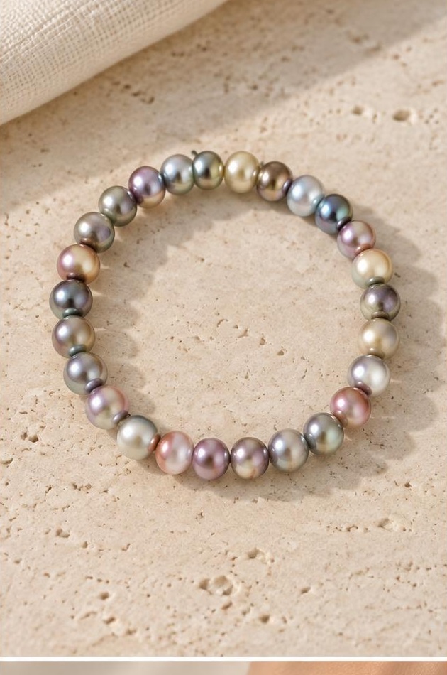 Iridescent Bead Bracelet on travertine