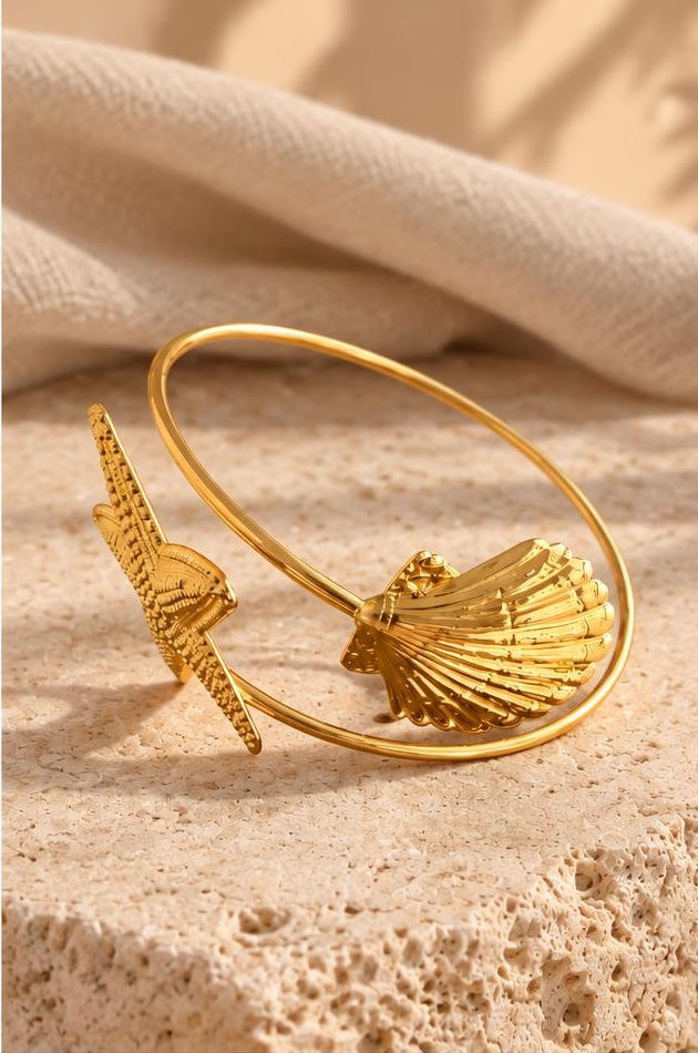 Gold-tone Shell Cuff on travertine