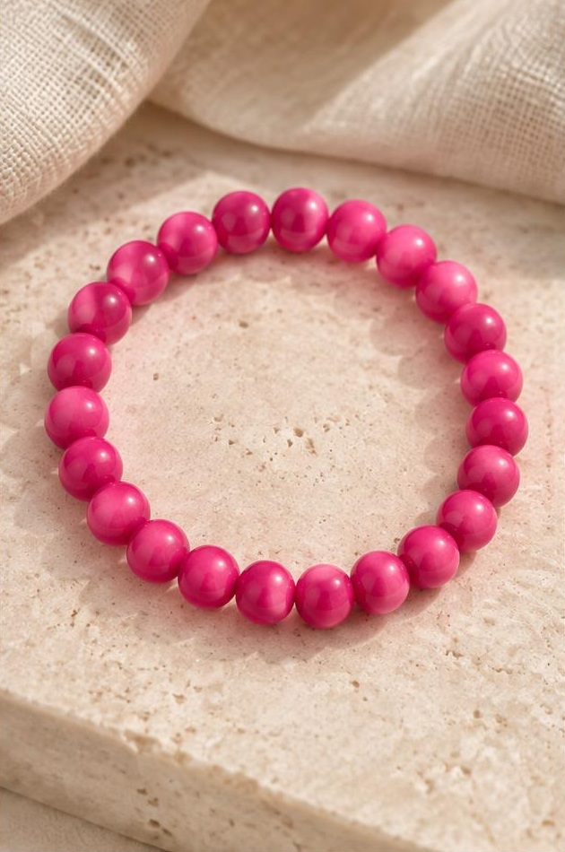 Fuchsia Bead Bracelet on travertine